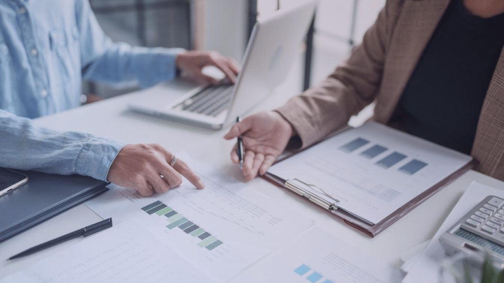 Two people looking over financial documents