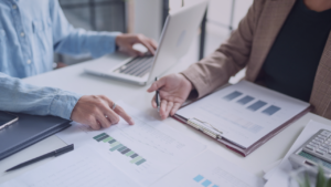 Two people looking over financial documents